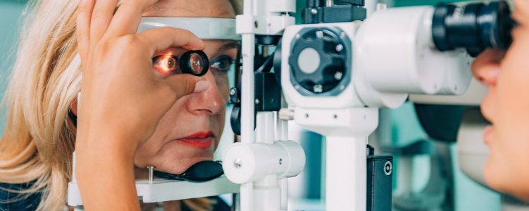 Woman getting eyesight checked by doctor